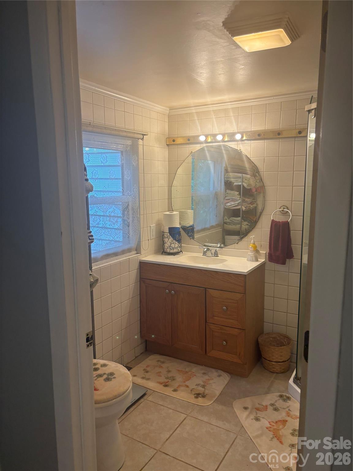 3880 Love Road Claremont, NC 28610 - Photo 9 of 14 a bathroom with a sink toilet and shower