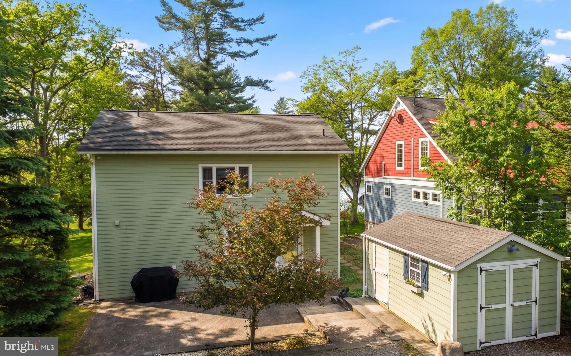 96 Whispering Way Swanton, MD 21561 - Photo 5 of 52 Rear facing patio with 2 storage sheds.