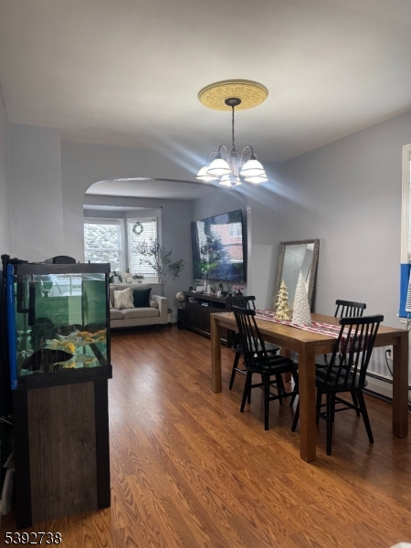 828 Allen Street Linden, NJ 07036 - Photo 11 of 17 a view of a dining room with furniture window and wooden floor