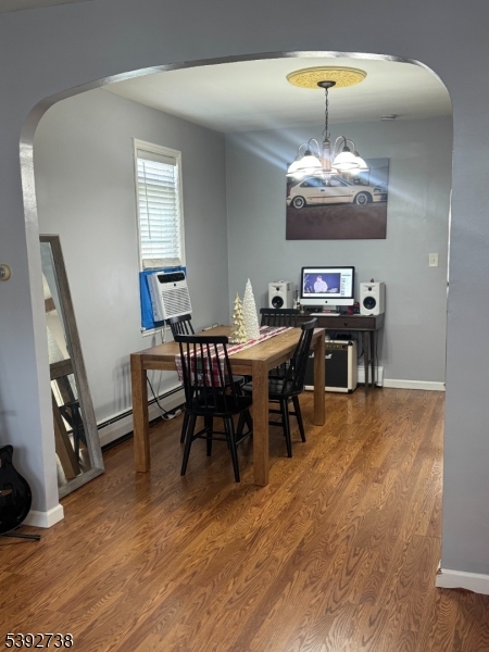 828 Allen Street Linden, NJ 07036 - Photo 12 of 17 a view of a dining room with furniture wooden floor and chandelier