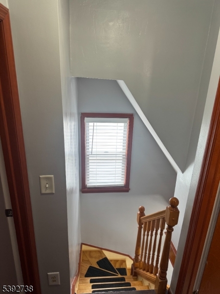 828 Allen Street Linden, NJ 07036 - Photo 15 of 17 a view of room with stairs and a window