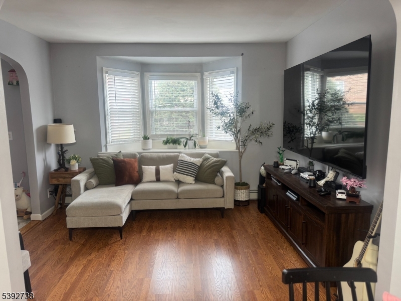 828 Allen Street Linden, NJ 07036 - Photo 8 of 17 a living room with furniture and a flat screen tv