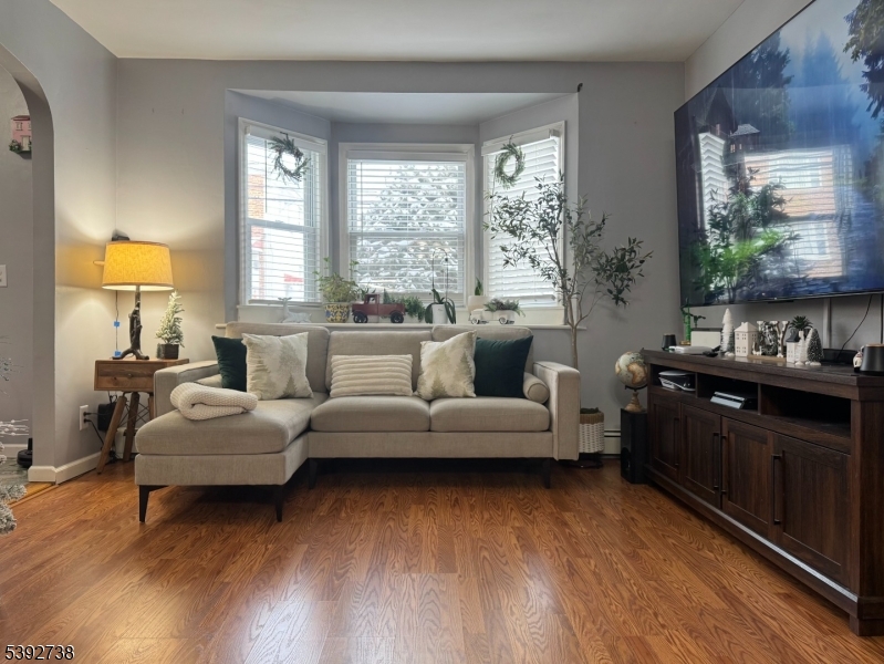 828 Allen Street Linden, NJ 07036 - Photo 9 of 17 a living room with furniture and a large window