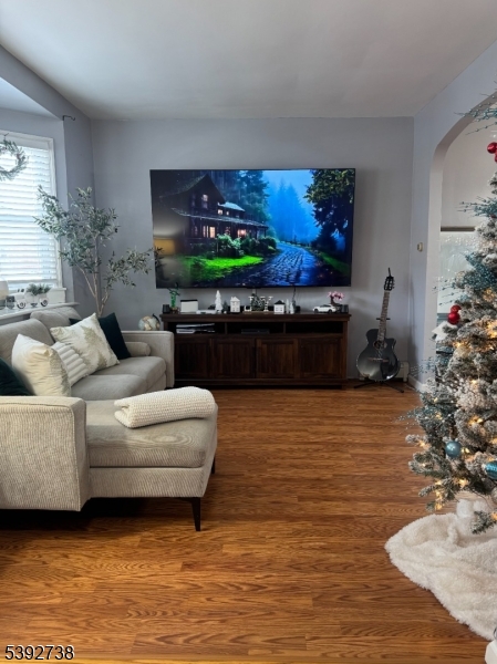 828 Allen Street Linden, NJ 07036 - Photo 10 of 17 a living room with furniture and a fireplace