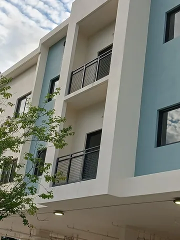a kitchen with stainless steel appliances a stove a sink and a microwave