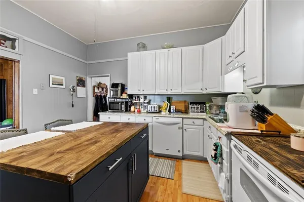a kitchen with a stove and a sink