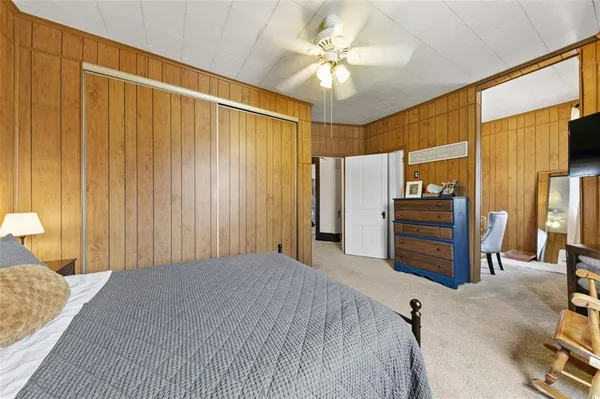 a bedroom with furniture and a chandelier