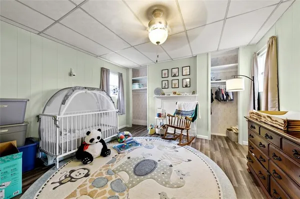 a bed room with furniture and a chandelier
