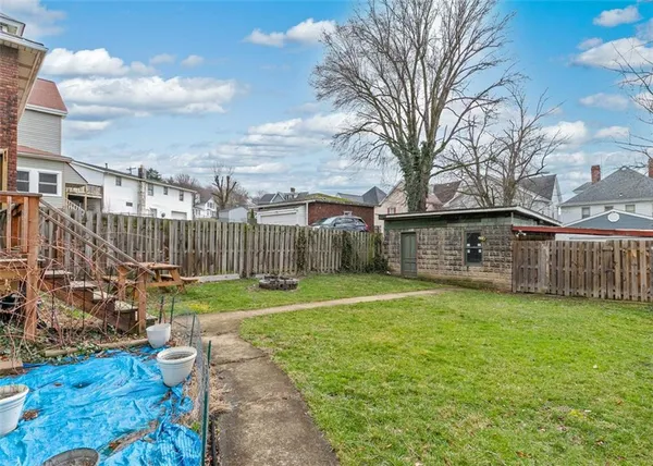 a view of a couches in backyard of house