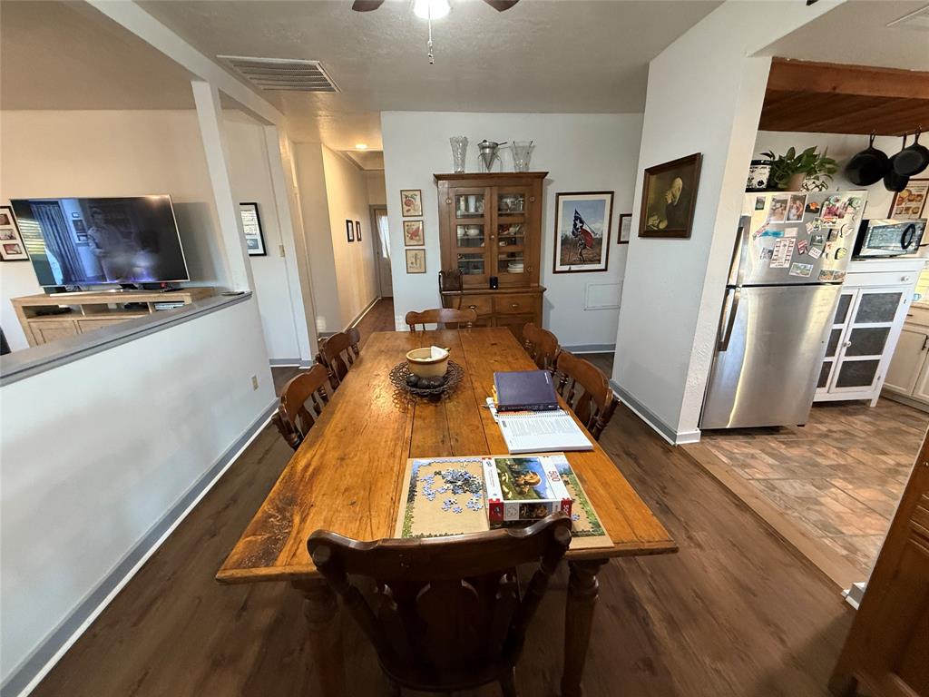 407 South Reagan Street Hamilton, TX 76531 - Photo 11 of 39 a room with furniture pool table flat screen tv and refrigerator