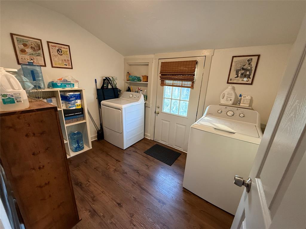 407 South Reagan Street Hamilton, TX 76531 - Photo 16 of 39 a room with furniture a window and wooden floor