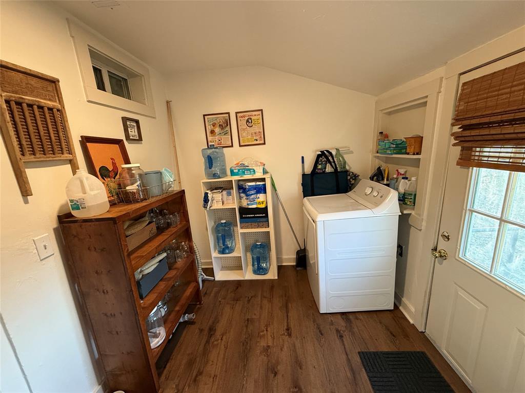 407 South Reagan Street Hamilton, TX 76531 - Photo 17 of 39 a view of walk in closet with clothes and shoes