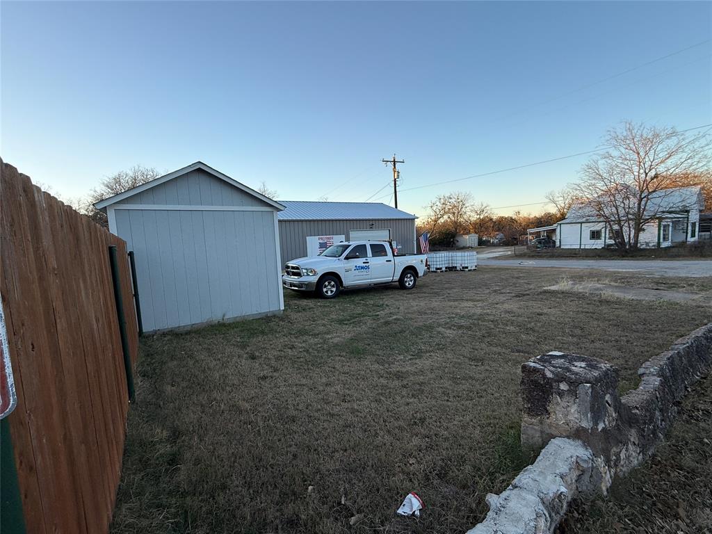 407 South Reagan Street Hamilton, TX 76531 - Photo 5 of 39 a car parked in front of a house