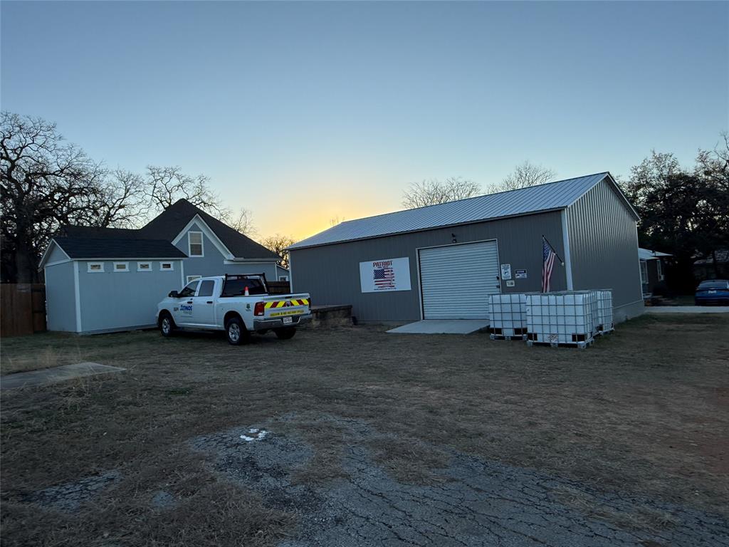 407 South Reagan Street Hamilton, TX 76531 - Photo 6 of 39 a view of a house with a yard