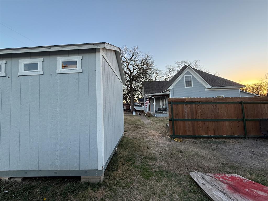 407 South Reagan Street Hamilton, TX 76531 - Photo 7 of 39 a view of a house with a yard