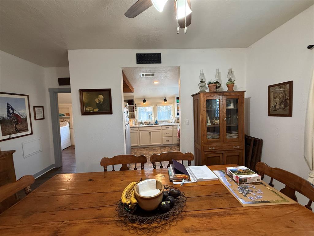 407 South Reagan Street Hamilton, TX 76531 - Photo 10 of 39 a close view of a living room and dining room