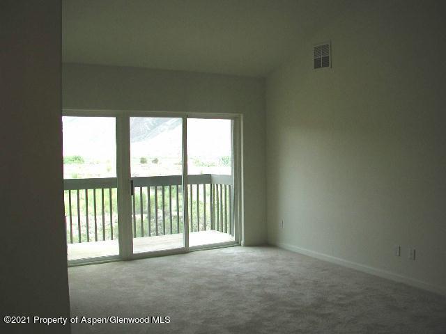794 Castle Valley Boulevard, Unit H New Castle, CO 81647 - Photo 4 of 8 a view of a room with a large window