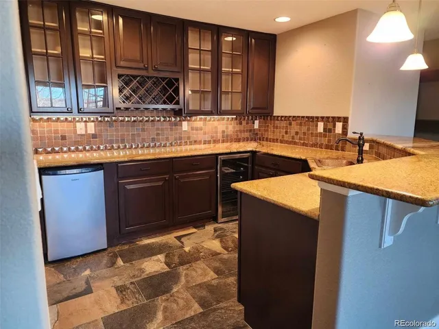 a kitchen with a sink and cabinets