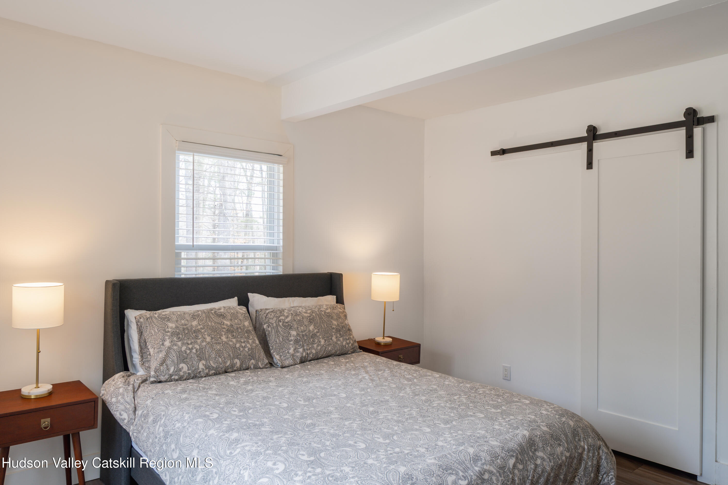 713 Oak Ridge Road Ellenville, NY 12428 - Photo 19 of 53 a bedroom with a bed and a night stand