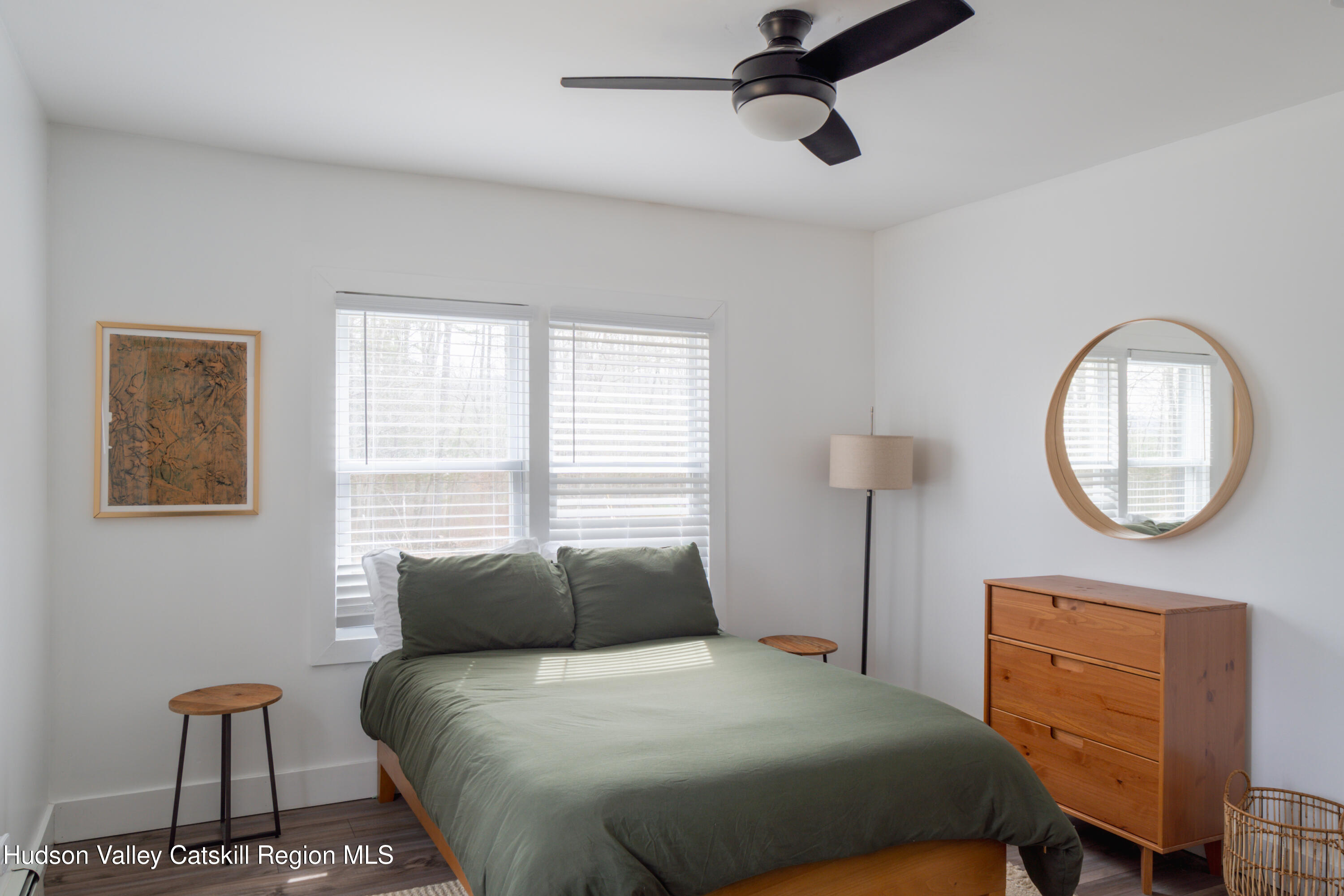 713 Oak Ridge Road Ellenville, NY 12428 - Photo 21 of 53 a bedroom with a bed a dresser and chair