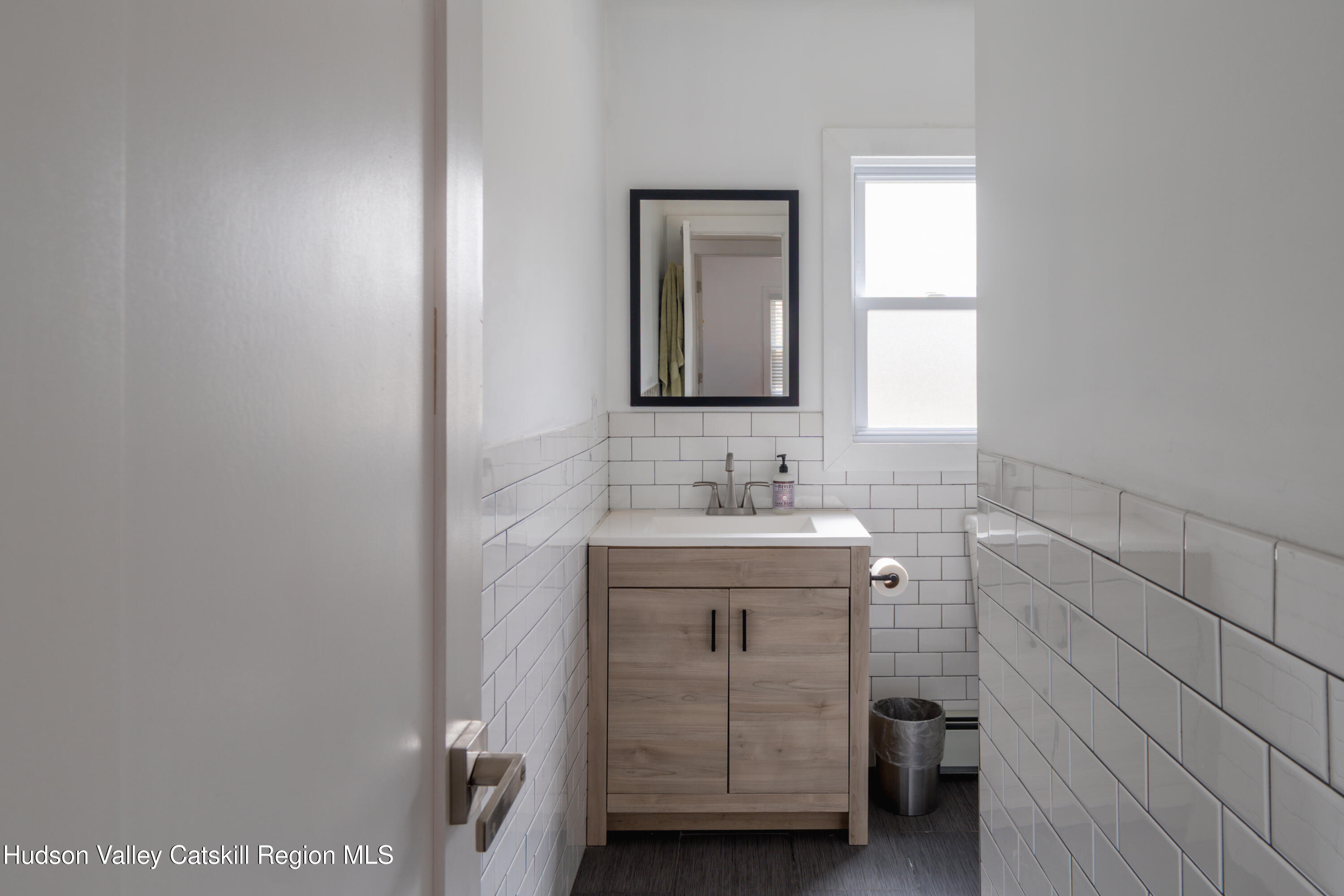 713 Oak Ridge Road Ellenville, NY 12428 - Photo 24 of 53 a bathroom with a sink toilet and mirror