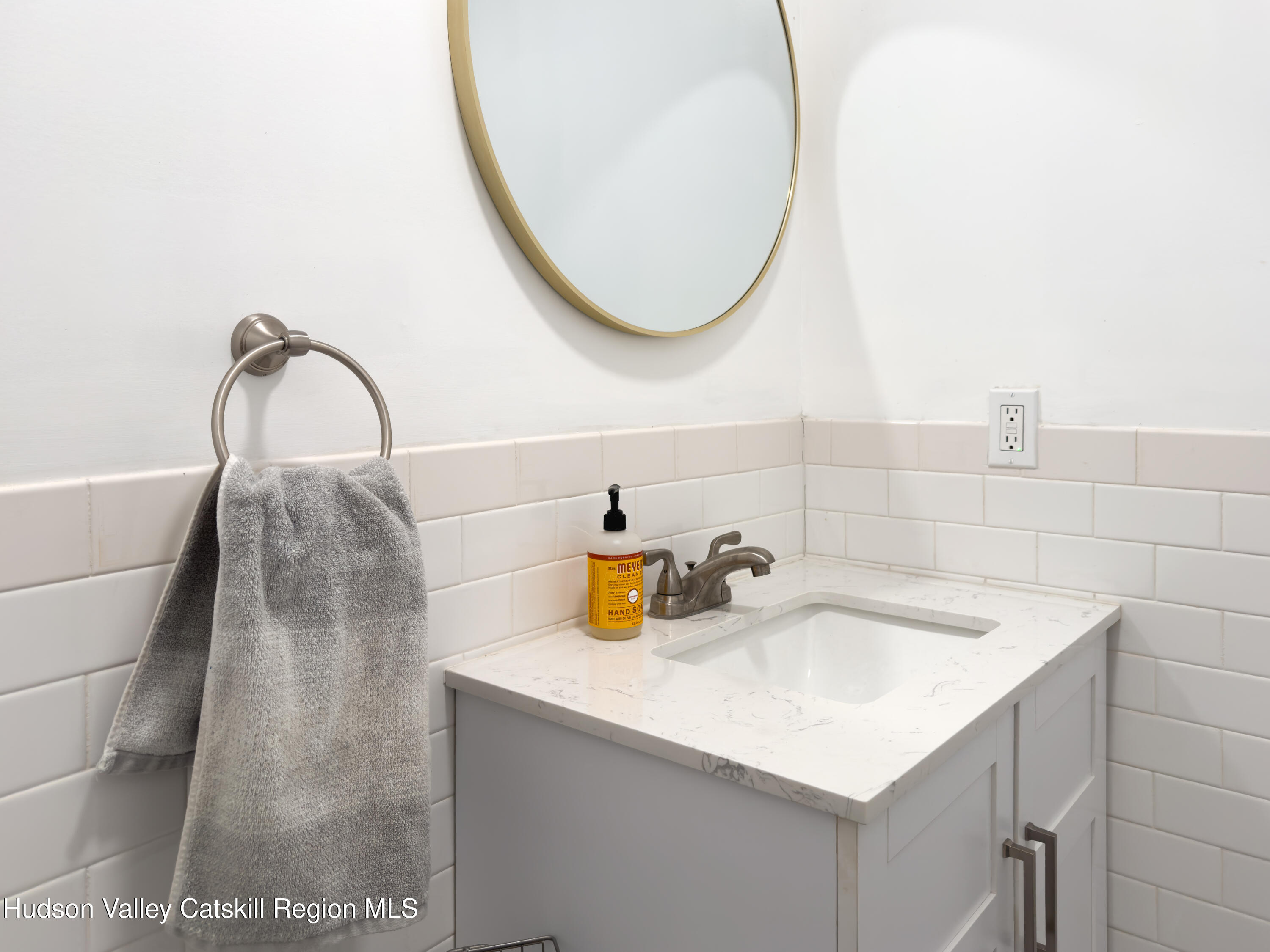 713 Oak Ridge Road Ellenville, NY 12428 - Photo 25 of 53 a bathroom with a sink and a mirror