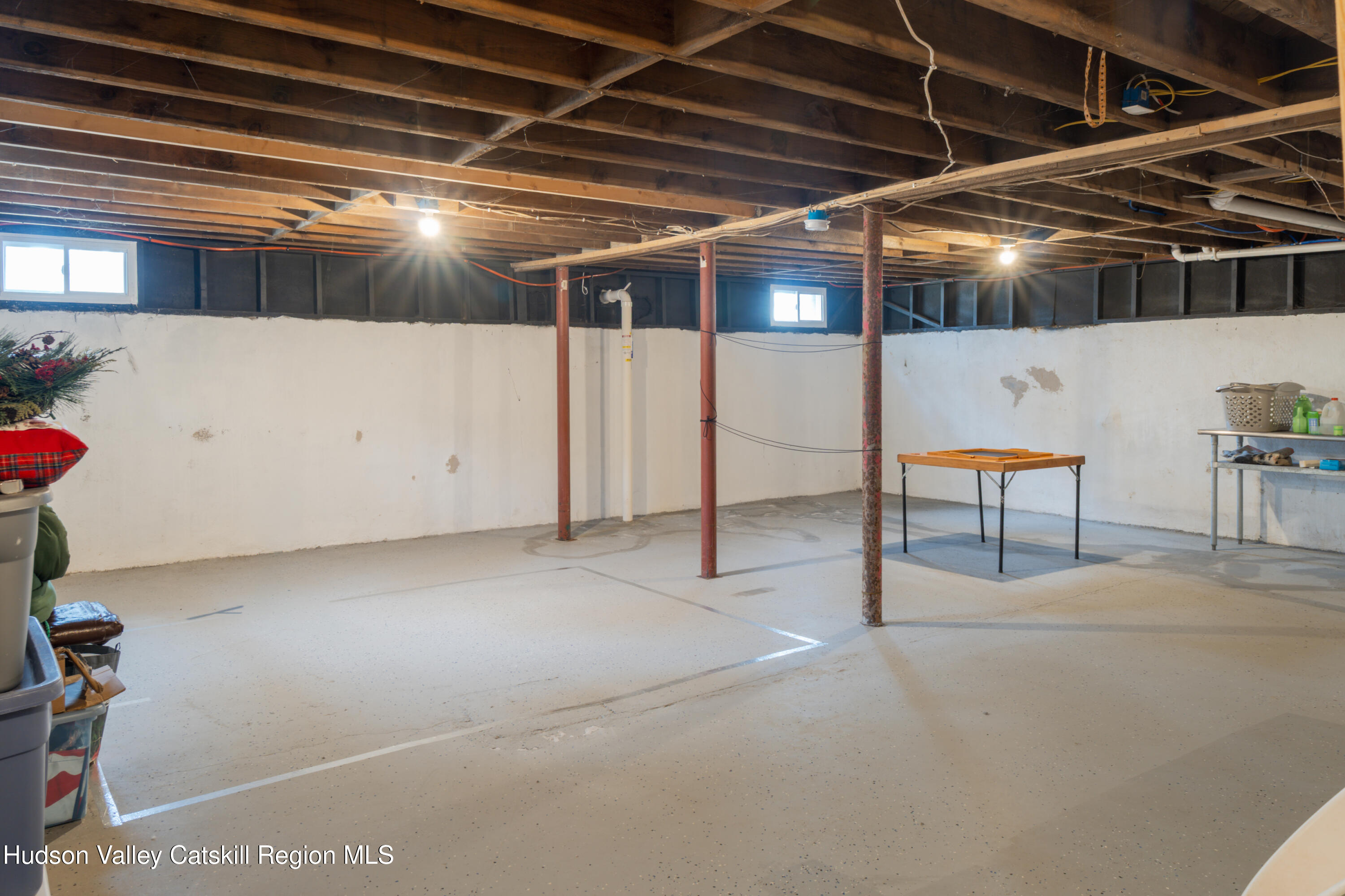 713 Oak Ridge Road Ellenville, NY 12428 - Photo 27 of 53 a view of an empty room with furniture and a window