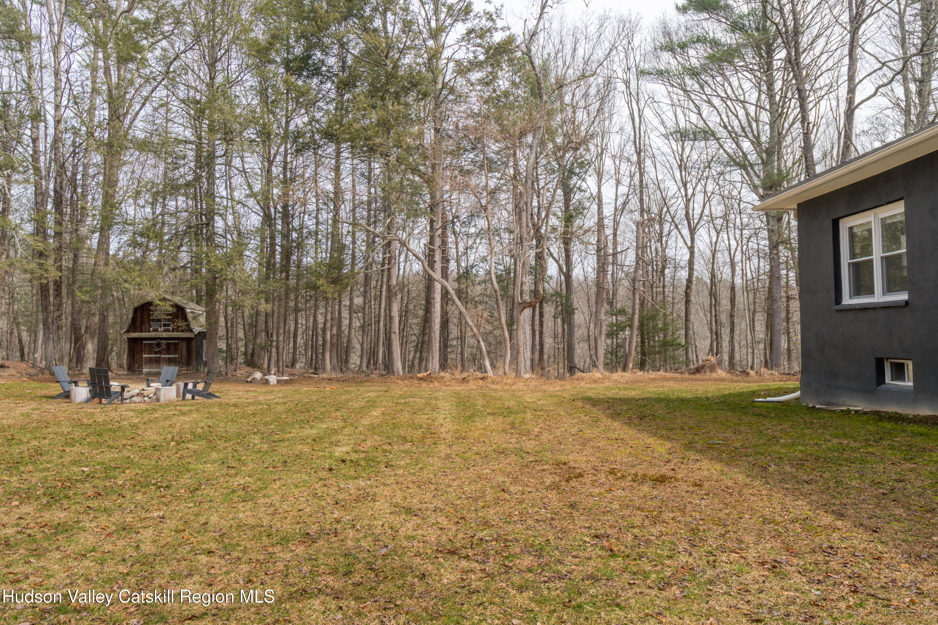 713 Oak Ridge Road Ellenville, NY 12428 - Photo 31 of 53 a view of a house with backyard and trees