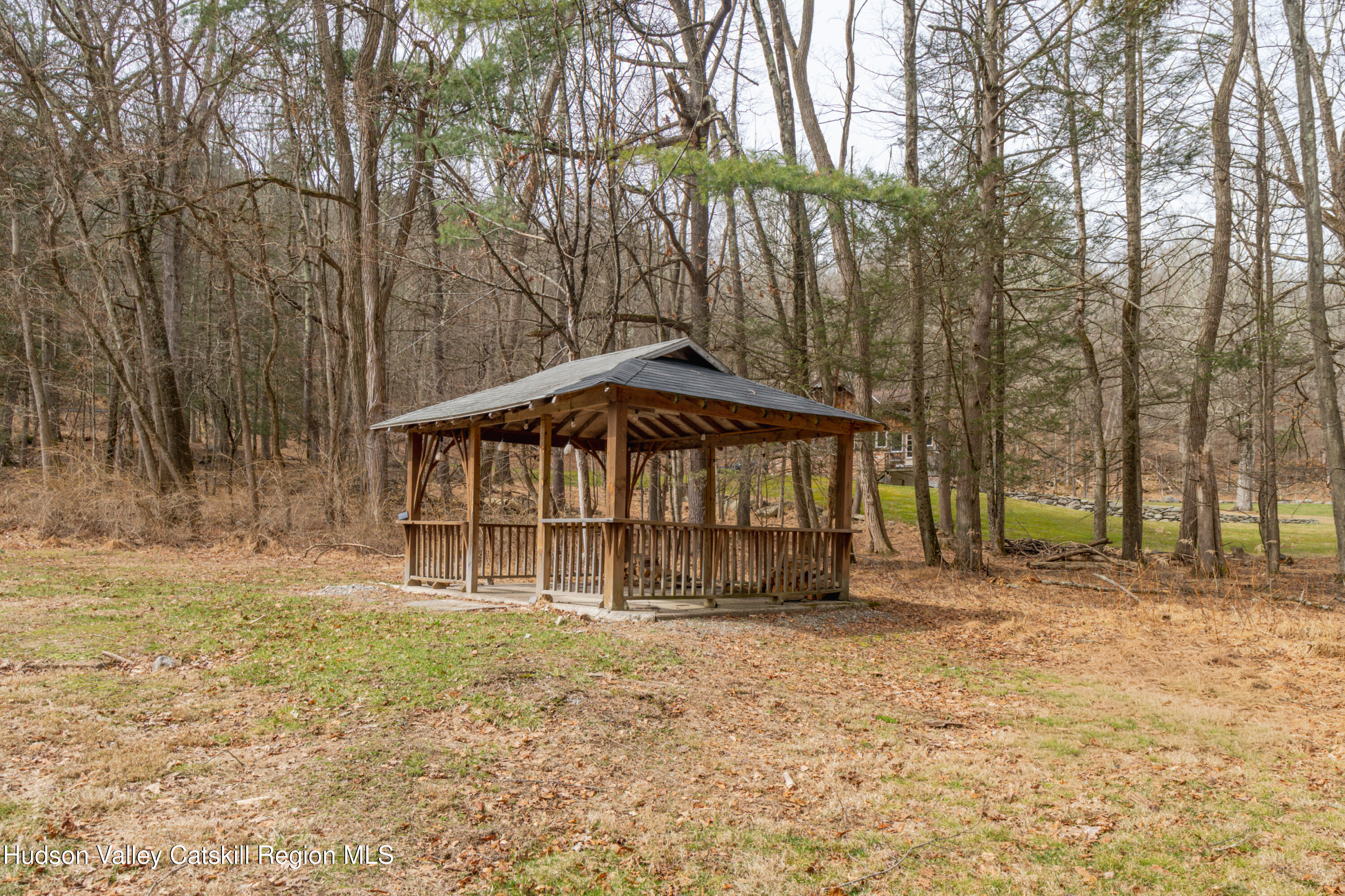 713 Oak Ridge Road Ellenville, NY 12428 - Photo 37 of 53 a backyard of a house with table and chairs