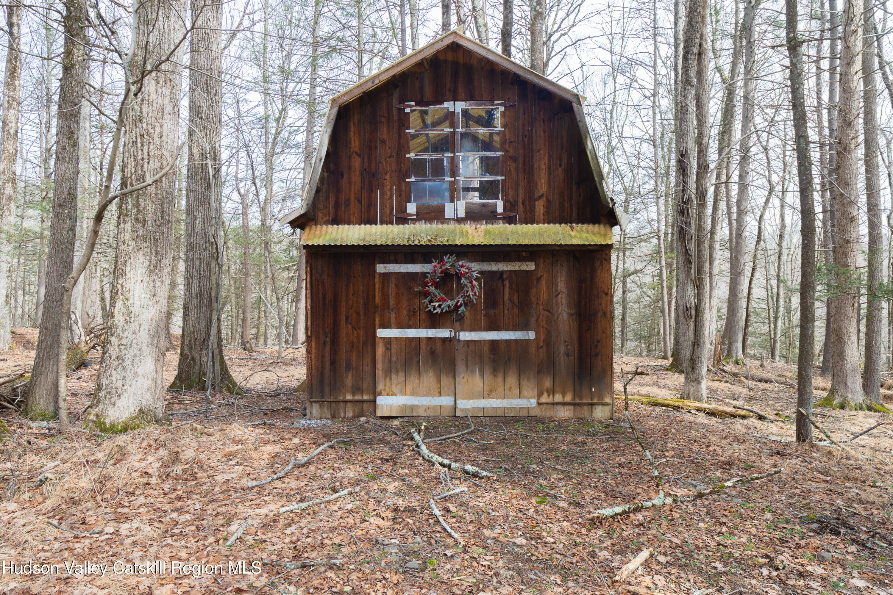 713 Oak Ridge Road Ellenville, NY 12428 - Photo 38 of 53 a front view of a house with a yard
