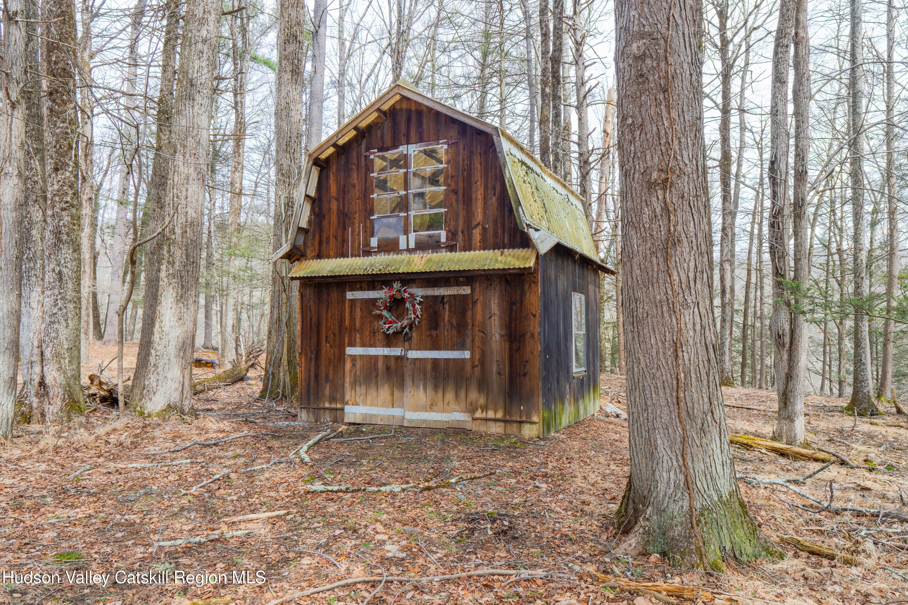 713 Oak Ridge Road Ellenville, NY 12428 - Photo 39 of 53 a front view of a house with a yard