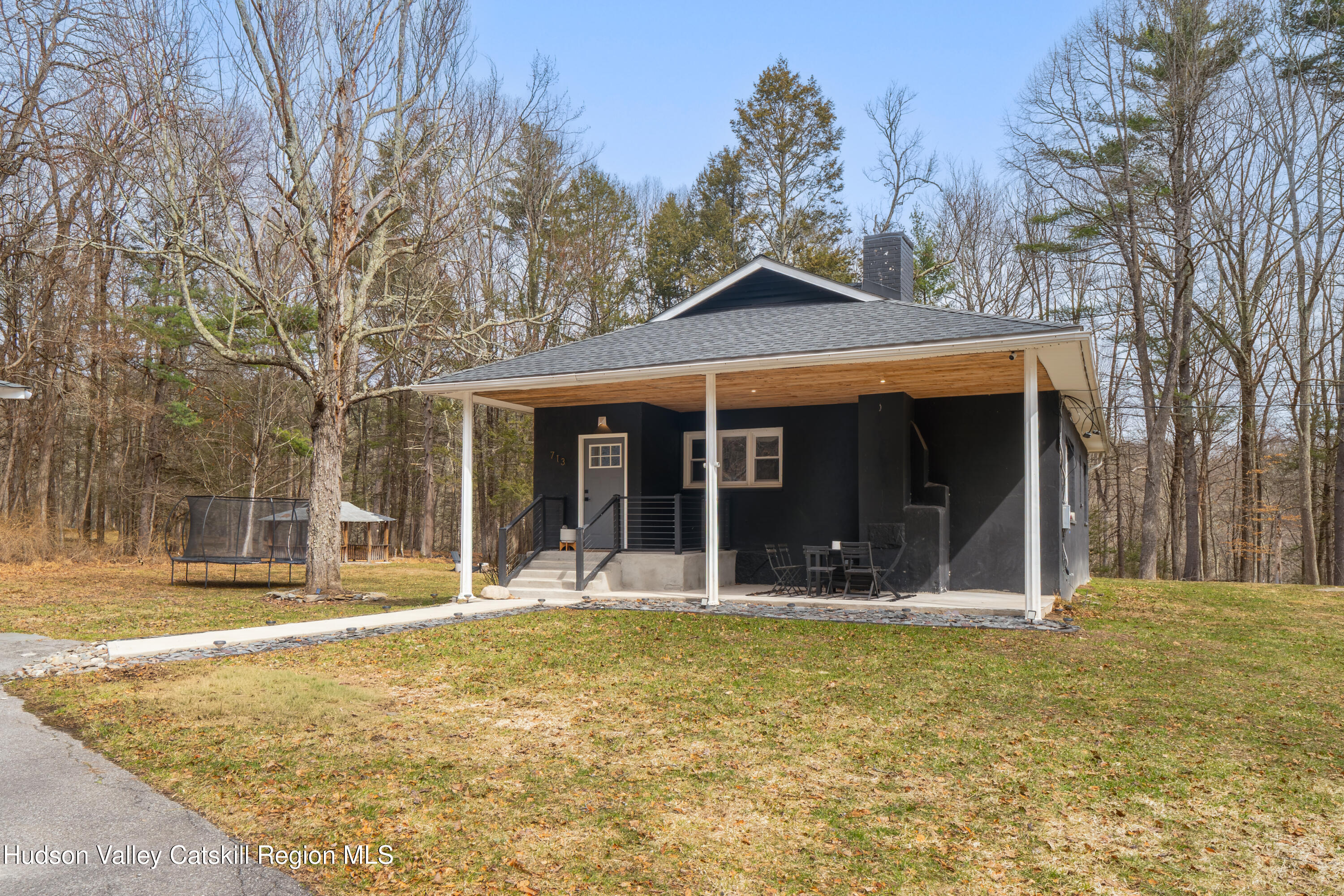 713 Oak Ridge Road Ellenville, NY 12428 - Photo 41 of 53 a backyard of a house with yard and outdoor seating
