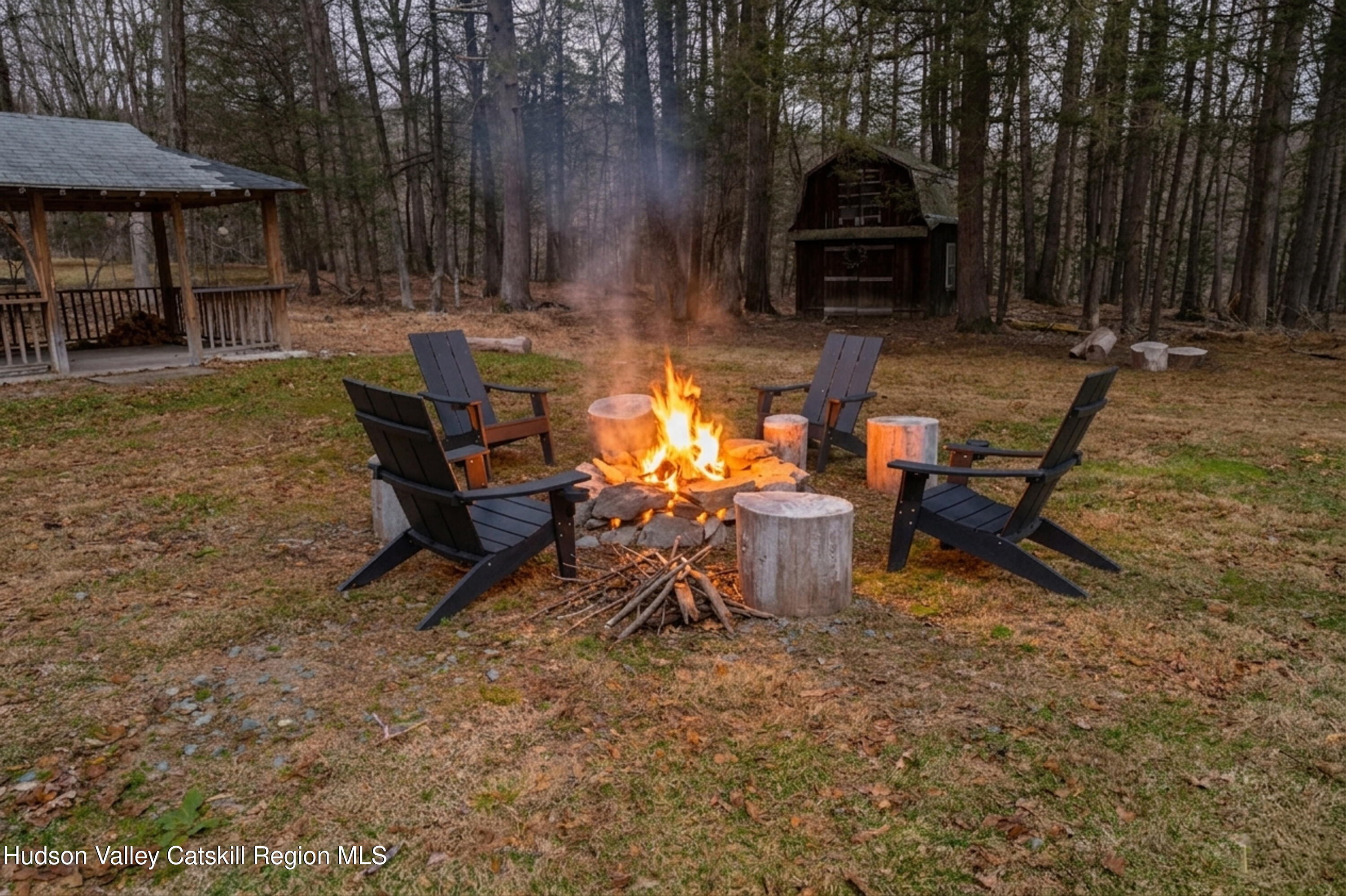 713 Oak Ridge Road Ellenville, NY 12428 - Photo 53 of 53 a view of a backyard with chairs and a fire pit
