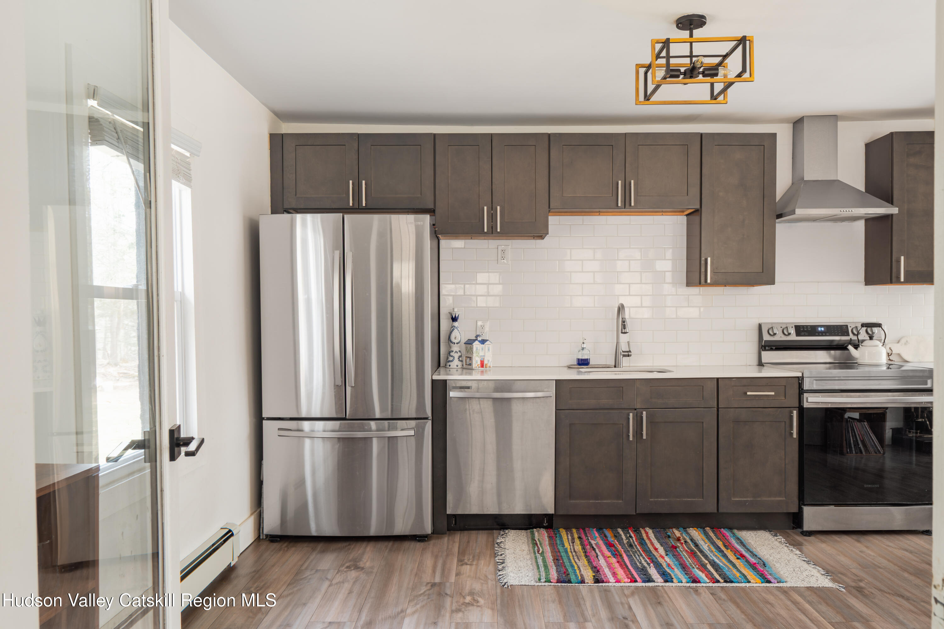 713 Oak Ridge Road Ellenville, NY 12428 - Photo 10 of 53 a kitchen with stainless steel appliances a refrigerator and a sink