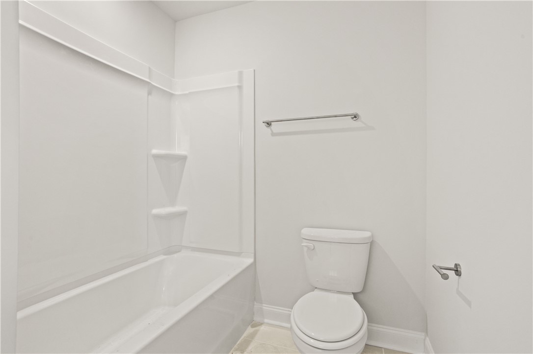 554 Hydrangea Street, Unit LOT 67 Seneca, SC 29678 - Photo 19 of 26 Functional full bathroom with a pristine tub and toilet, ready for daily routines.