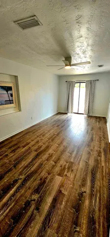 a view of an empty room and window