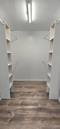 a view of an empty walk in closet