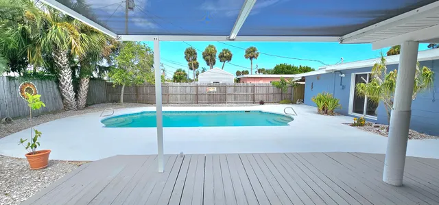 front view of a house with a swimming pool