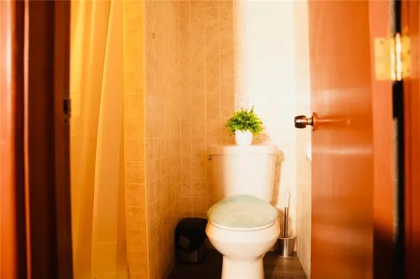 a bathroom with a shower curtain and a sink