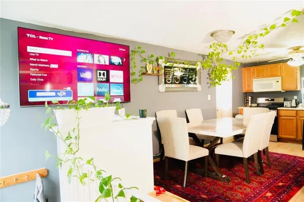 a dining room with furniture and window