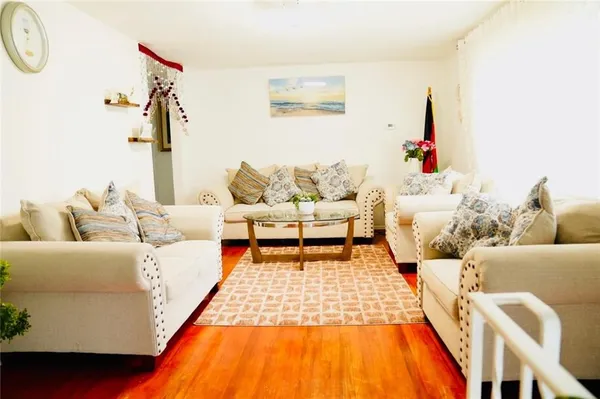 a living room with furniture and a rug