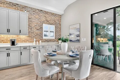 a view of a dining room with furniture window and outside view