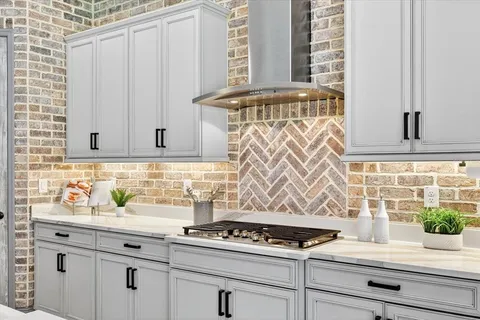 a bathroom with a granite countertop double vanity sink and a mirror