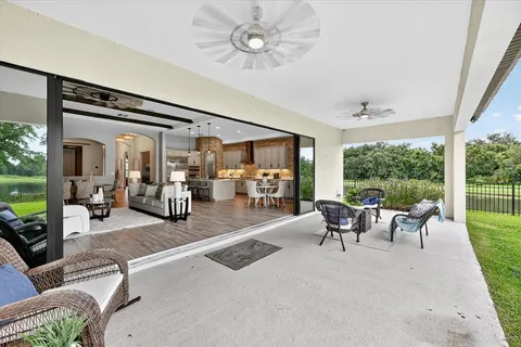 a bathroom with a granite countertop sink a toilet and a mirror