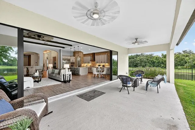 a bathroom with a granite countertop sink a toilet and a mirror