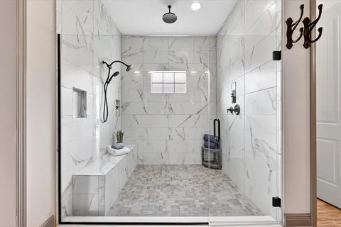 a view of a house with a yard and sitting area