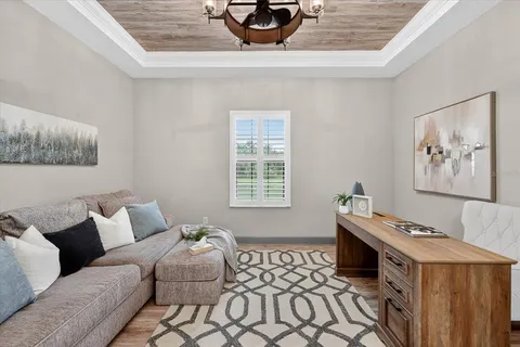 a view of a patio with couches chairs and a big yard