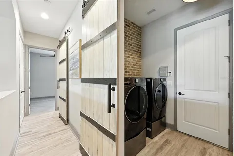 an aerial view of a house with garden space and street view