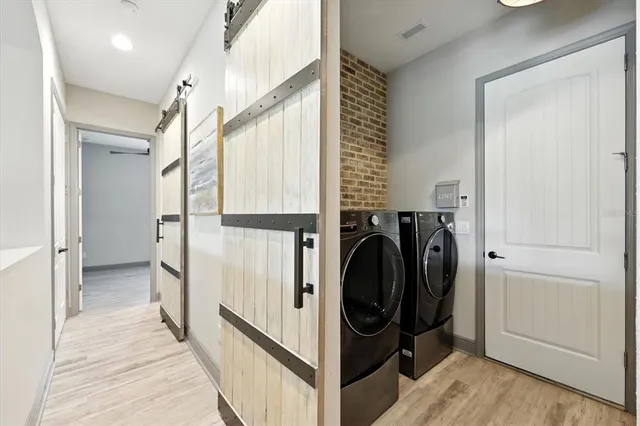 an aerial view of a house with garden space and street view