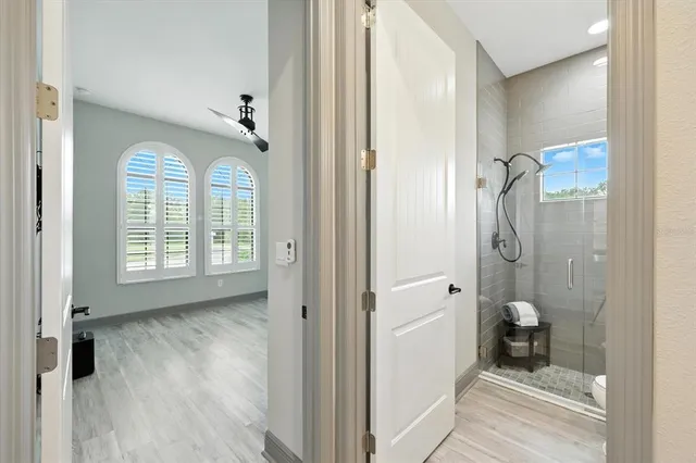 an aerial view of a house with a garden and sitting area